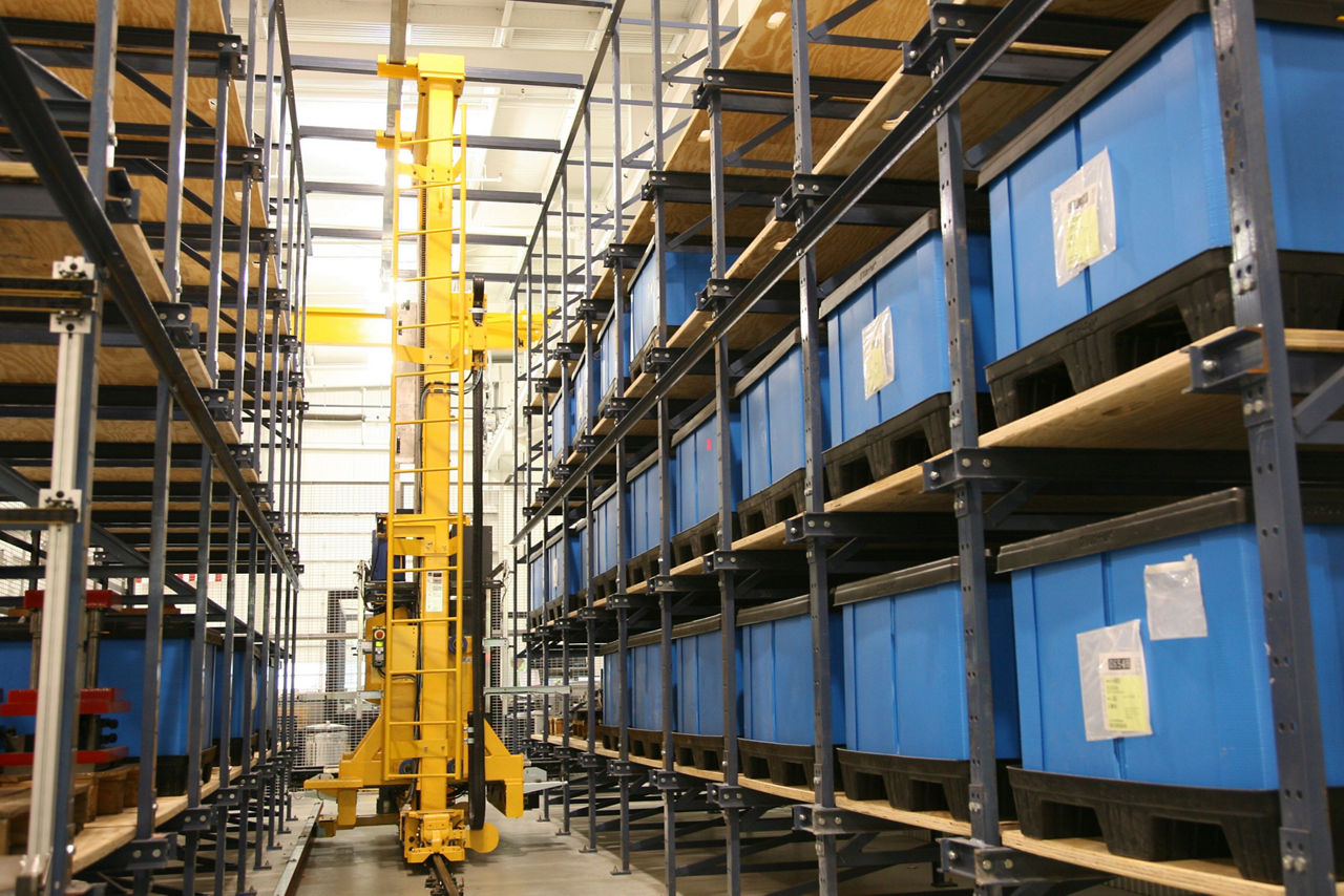 bastian solutions ASRS crane moving down aisle