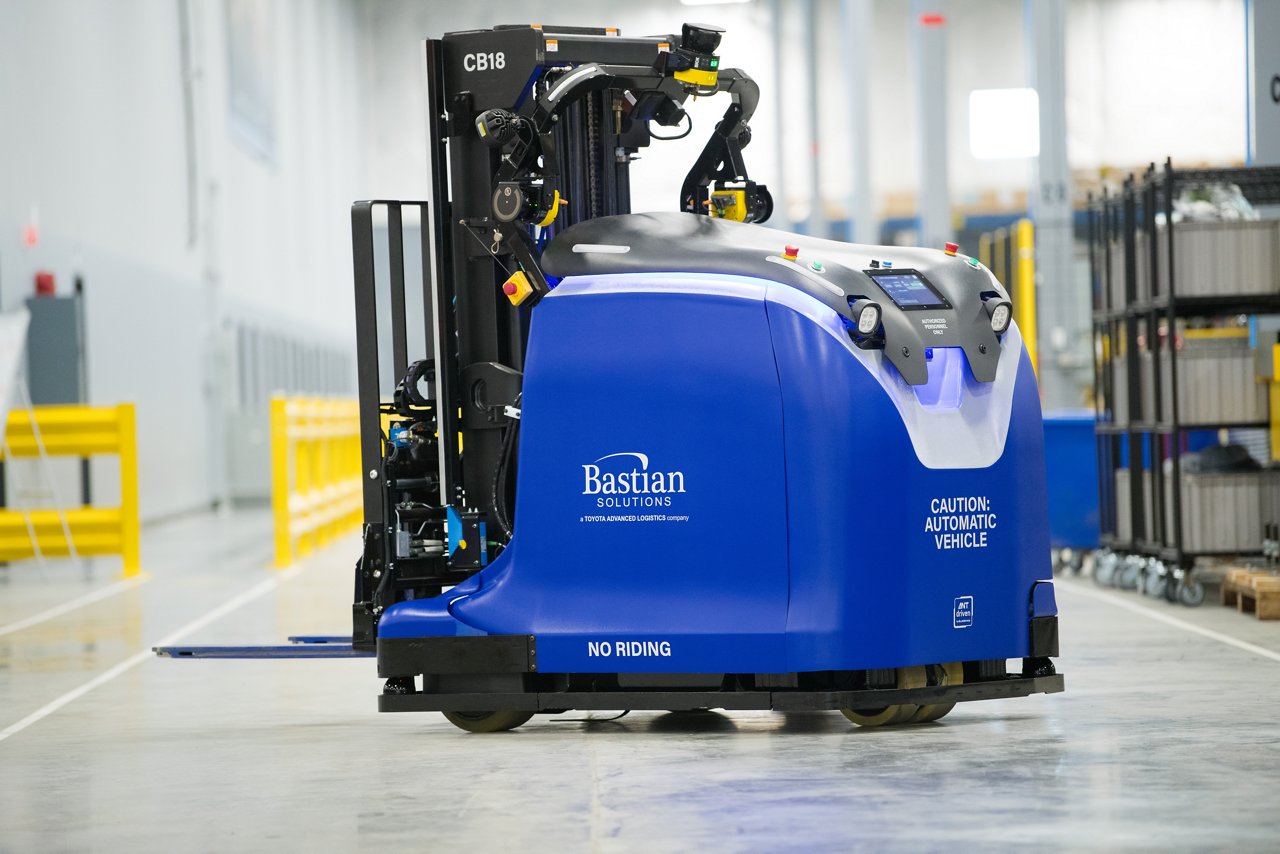 large blue automated forklift that is used to transport heavy loads through warehouse or distribution center
