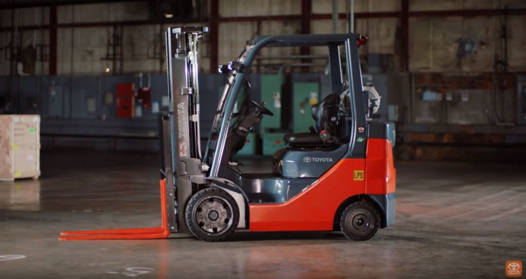 Core IC forklift truck parked in a warehouse, shown from the side.