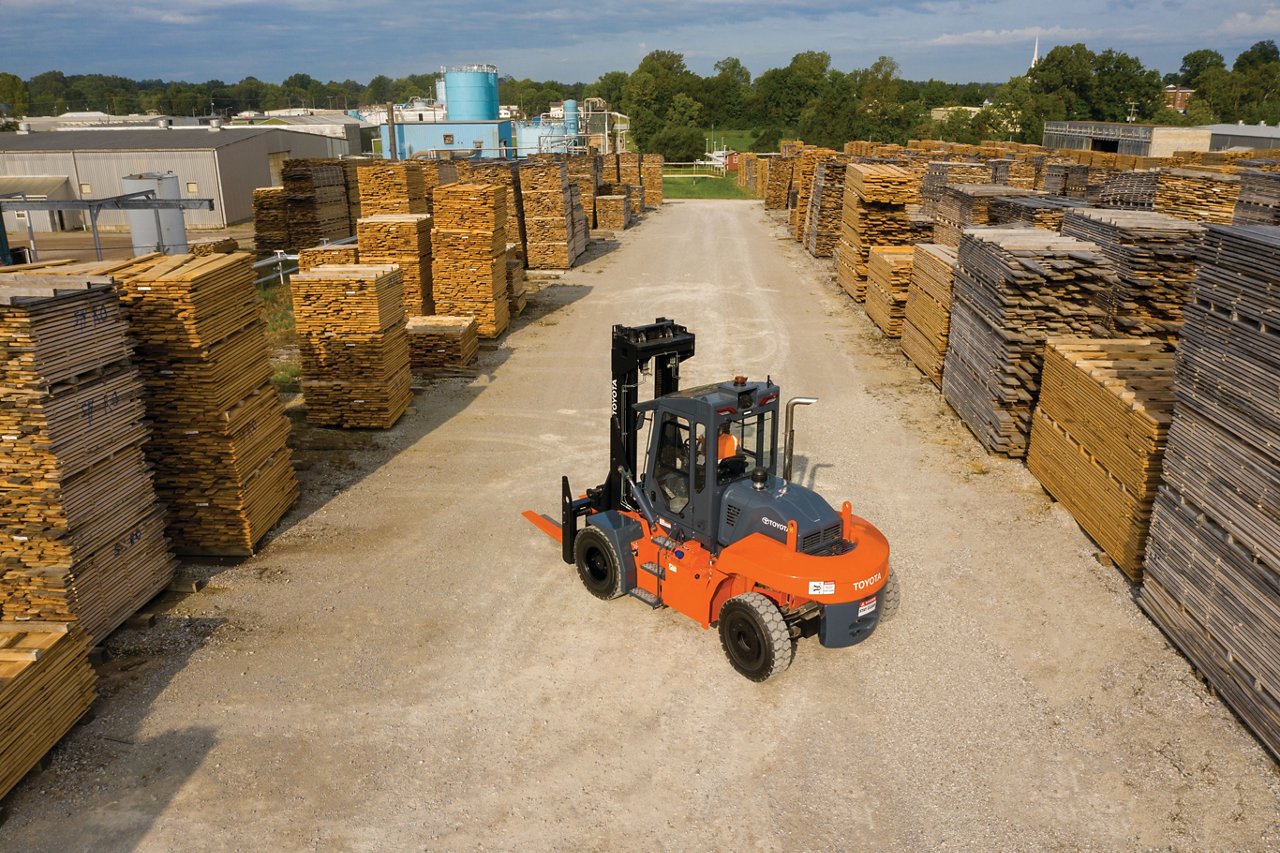 High Capacity Core IC Pneumatic  forklift parked outside in lumbar storage lot 