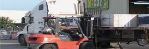 Loading forklifts with material in car parks 
