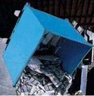 Close up shot of a Blue Rotator dumping out silver materials 