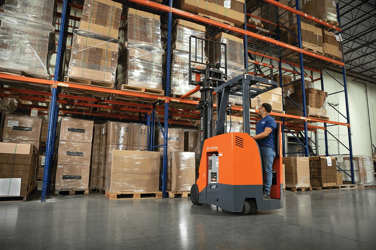 Man using Toyota Stand Up Rider in warehouse 