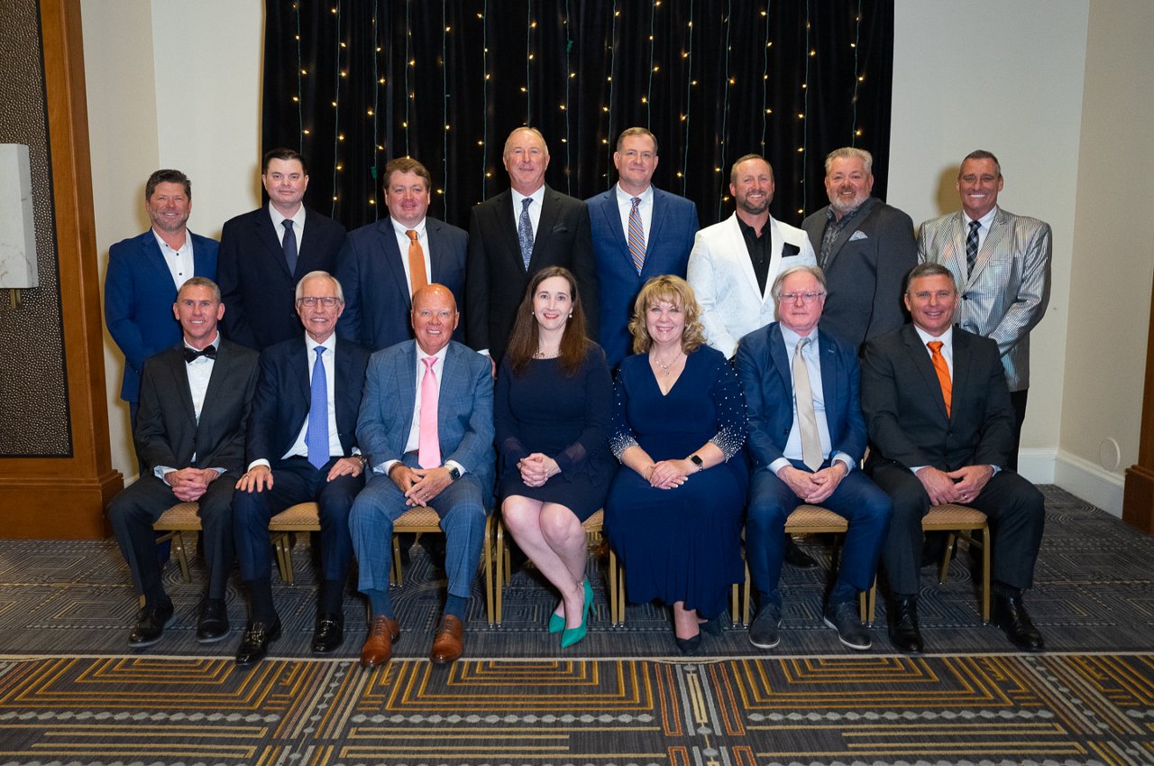 group photo of men and women recognized for award that they won