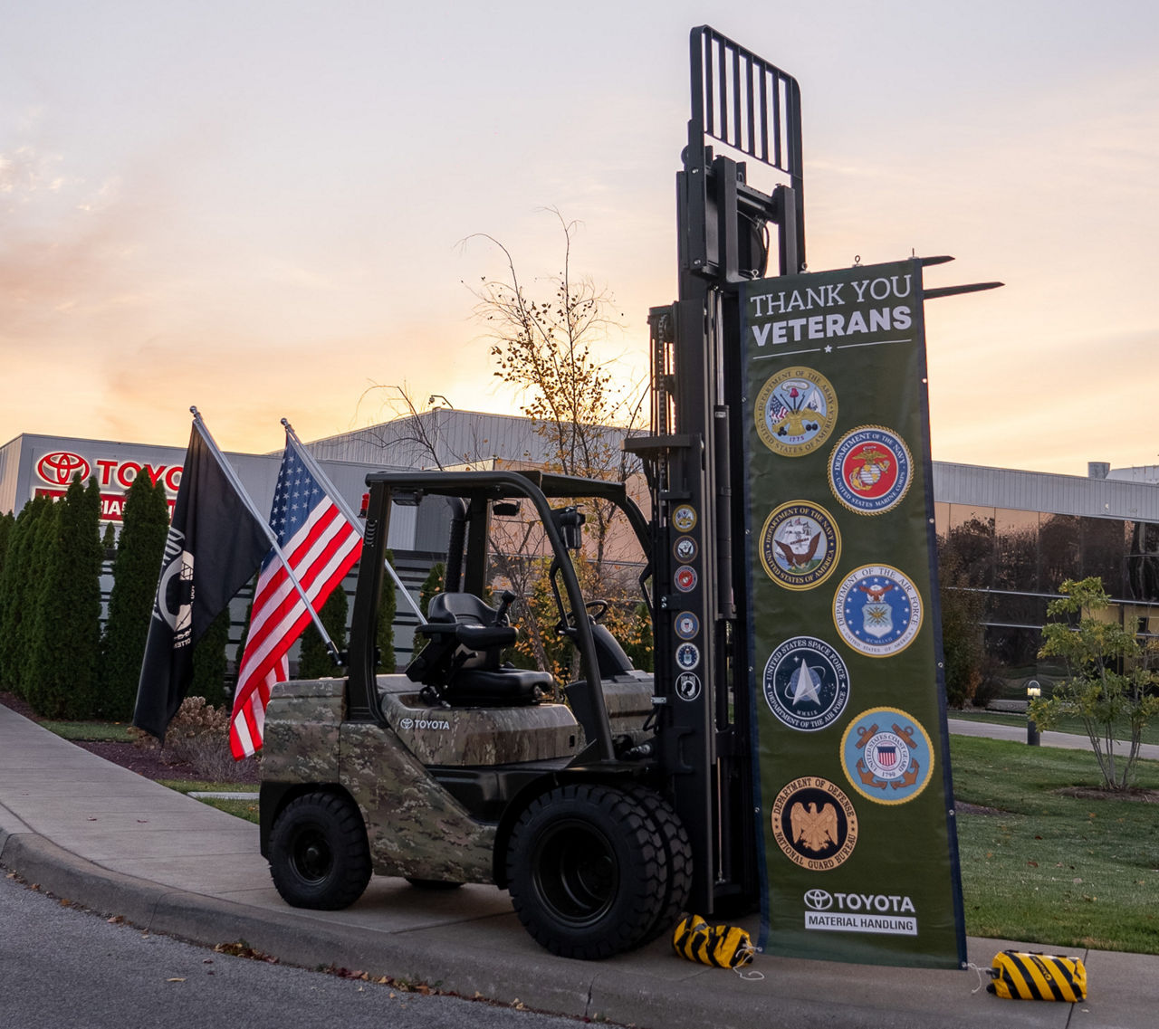 toyota forklift sitting outside plant with military logos