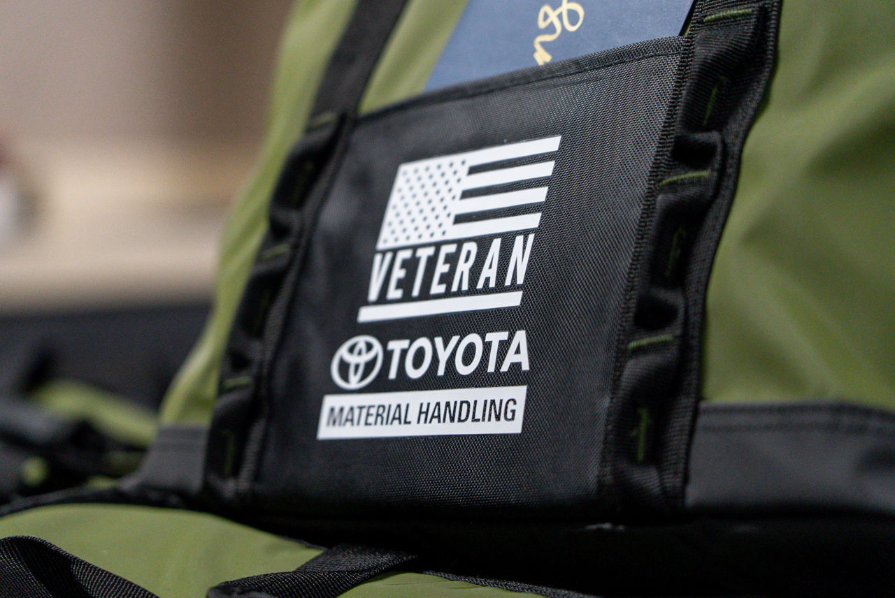 duffle bag with TMH logo and veterans with flag