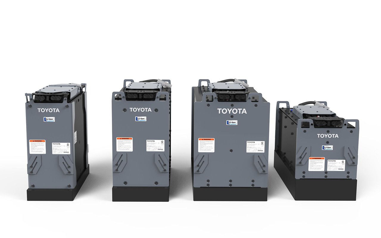 Four grey and black Toyota-branded batteries displayed side by side 