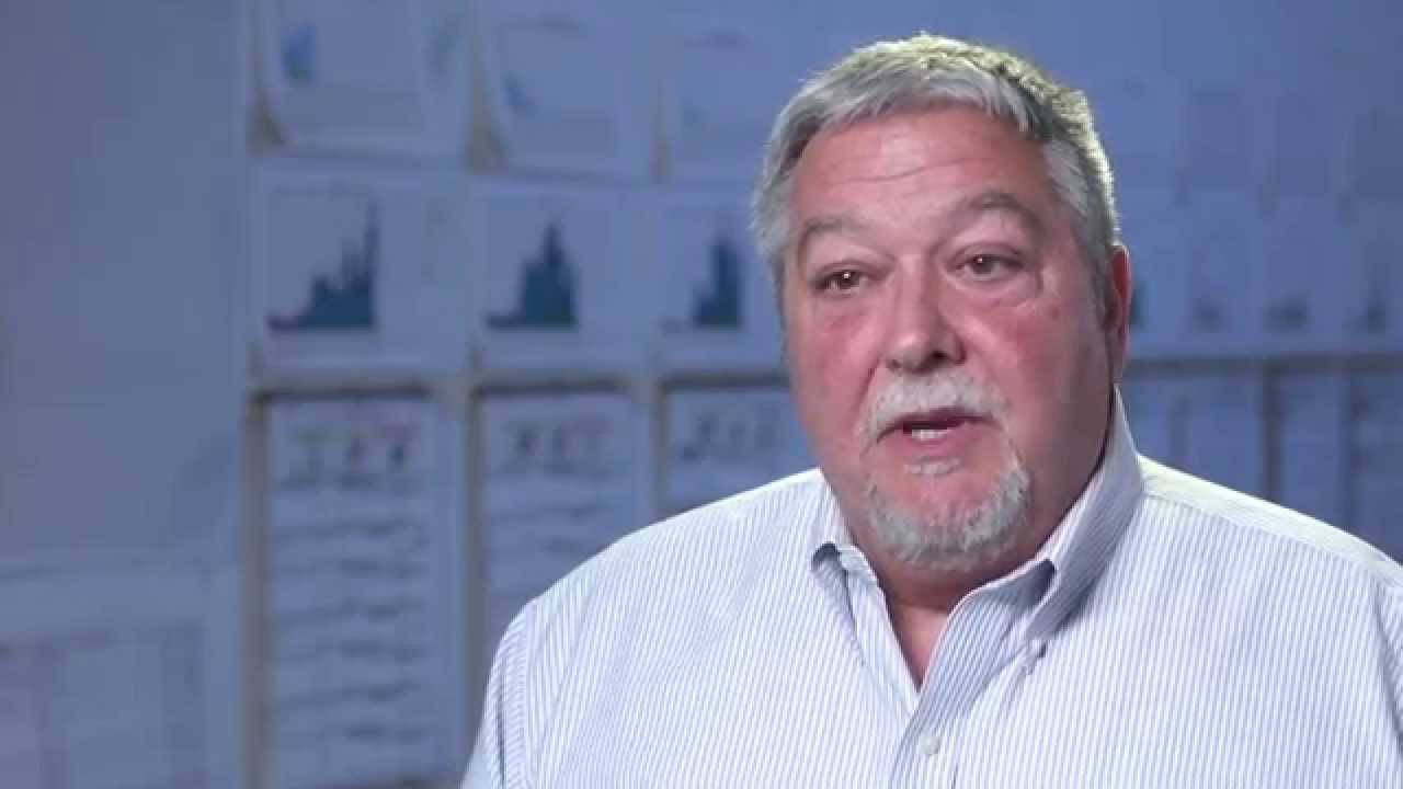 Close up of Employee talking to camera in office room
