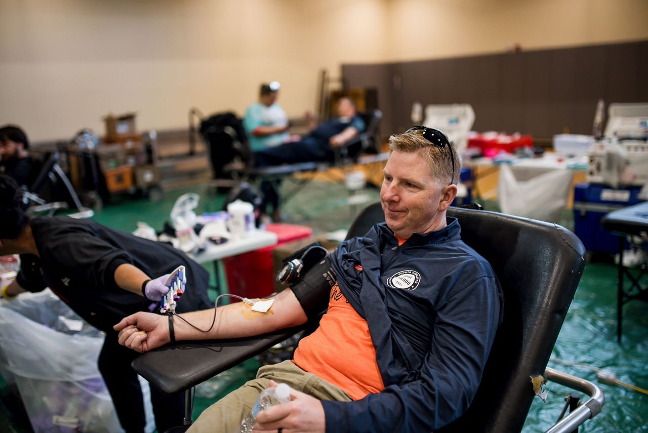 tmh employee giving blood for the Red Cross
