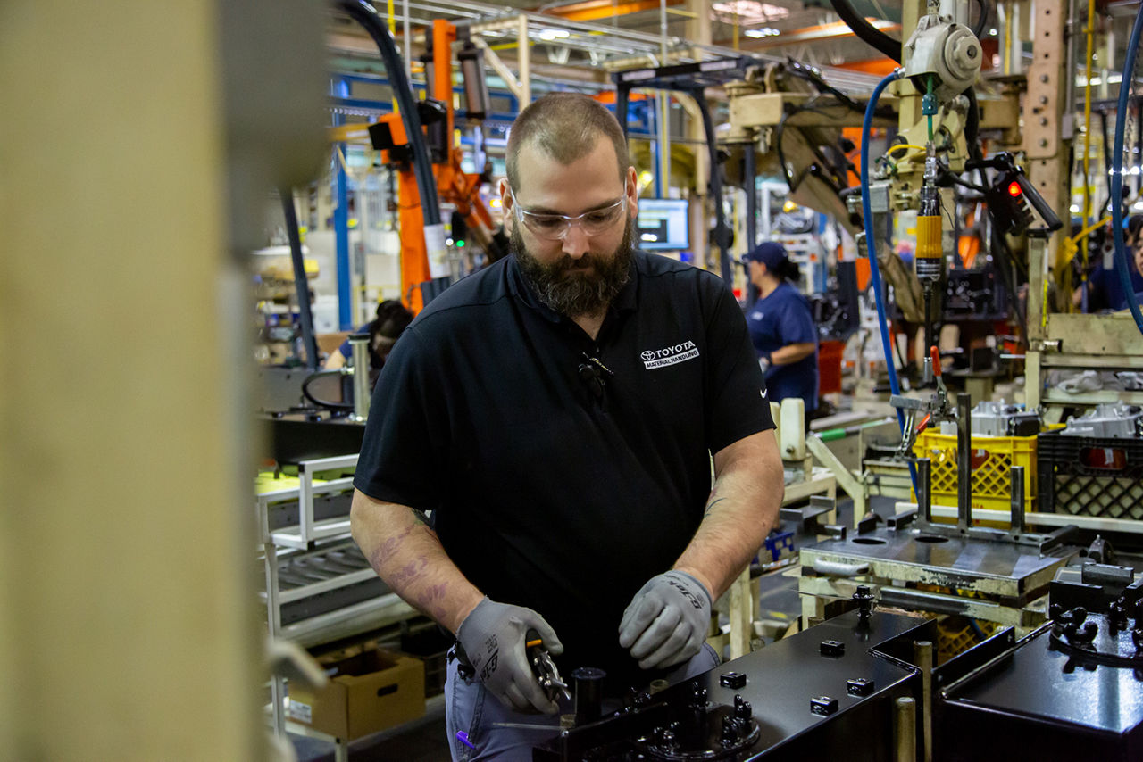 white male working on manufacturing line