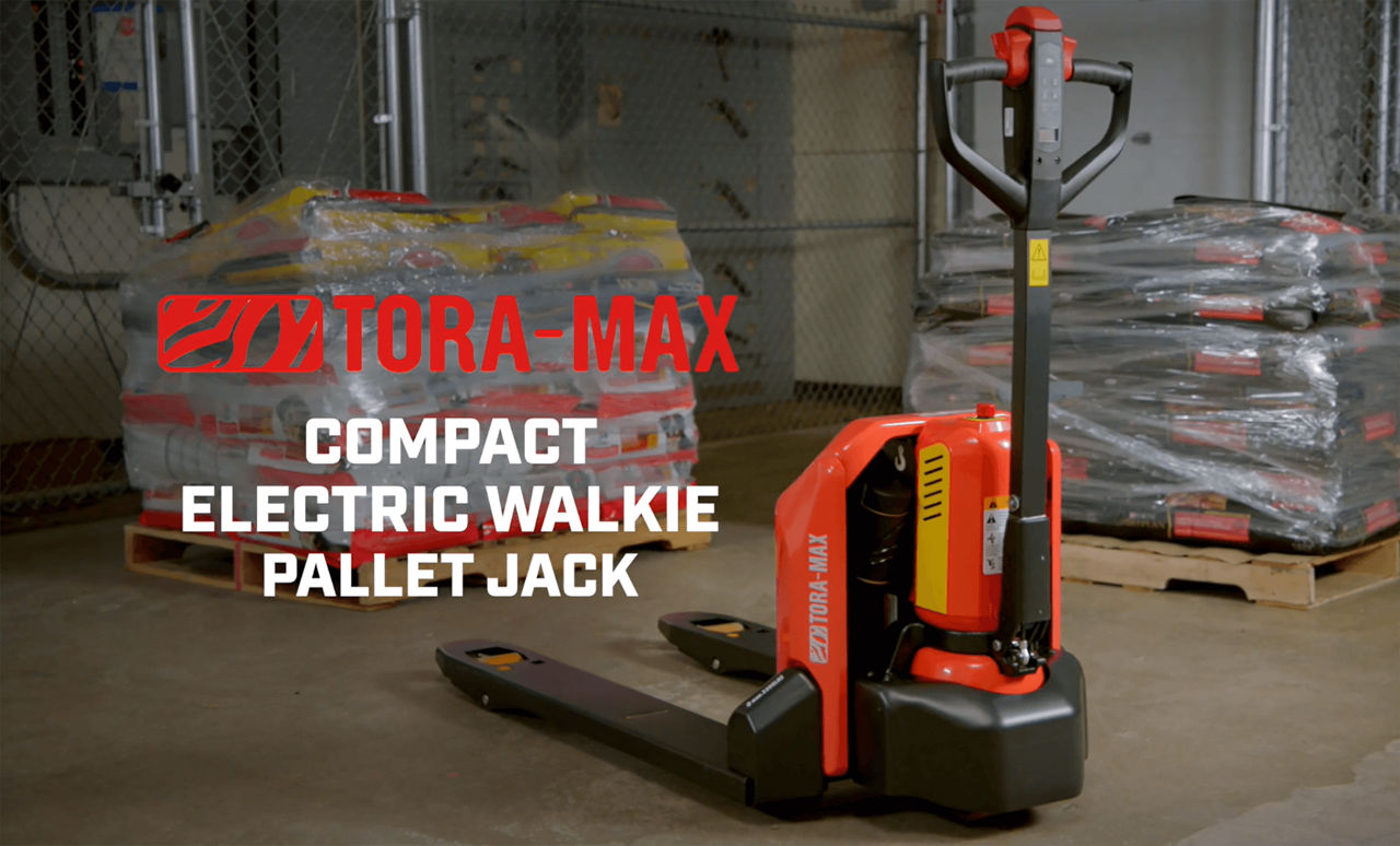 Toyota Tora-Max Compact Electric Walkie Pallet Jack parked in a warehouse with a text that reads: "Tora-max compact electric walkie pallet jack".