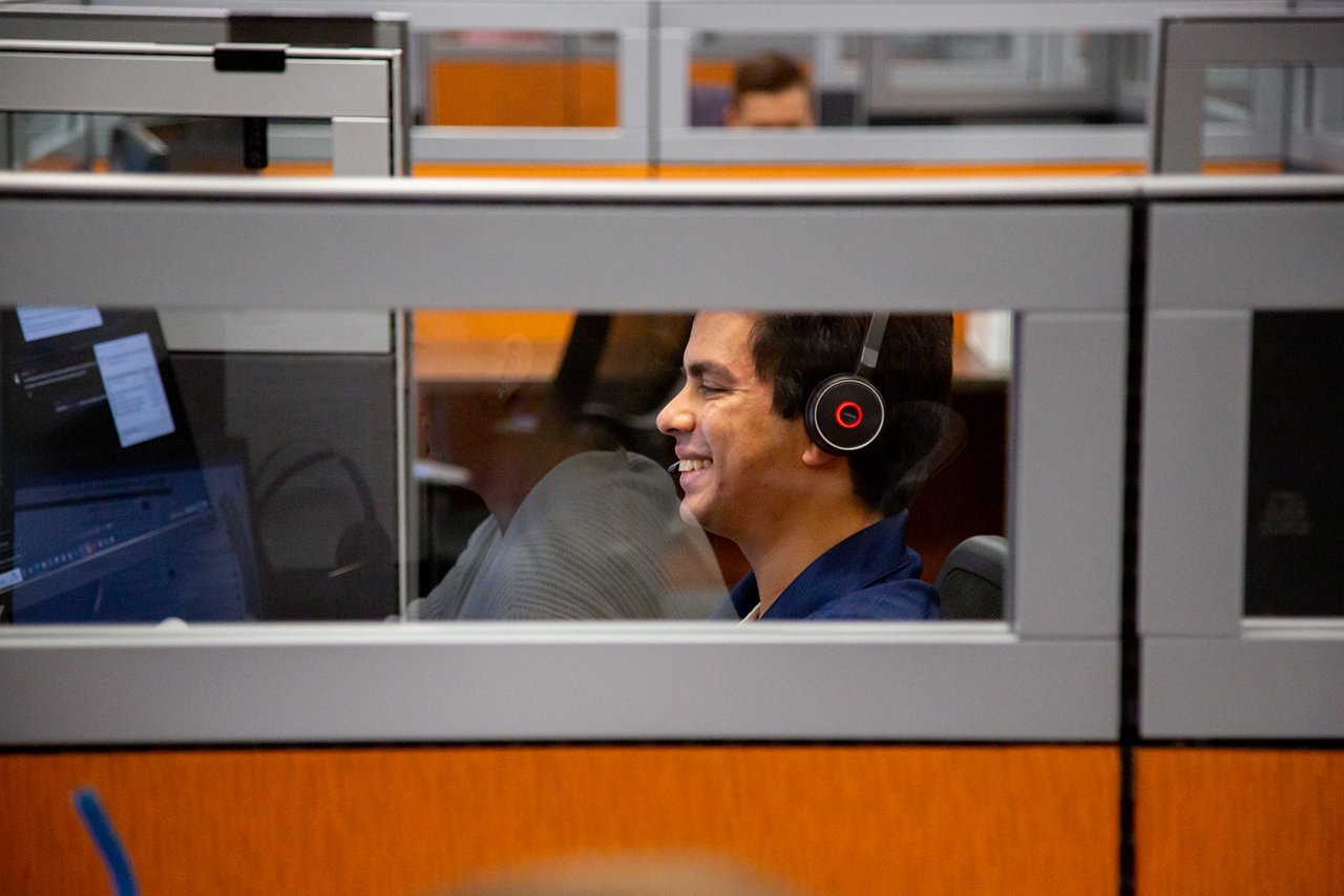 toyota office employee smiling through glass